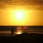 Fisherman at Shark's Cove at sunset.